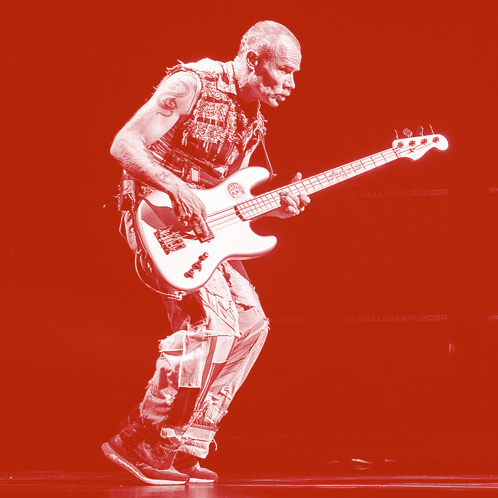 Flea of Red Hot Chili Peppers playing his Fender Jazz Bass guitar
