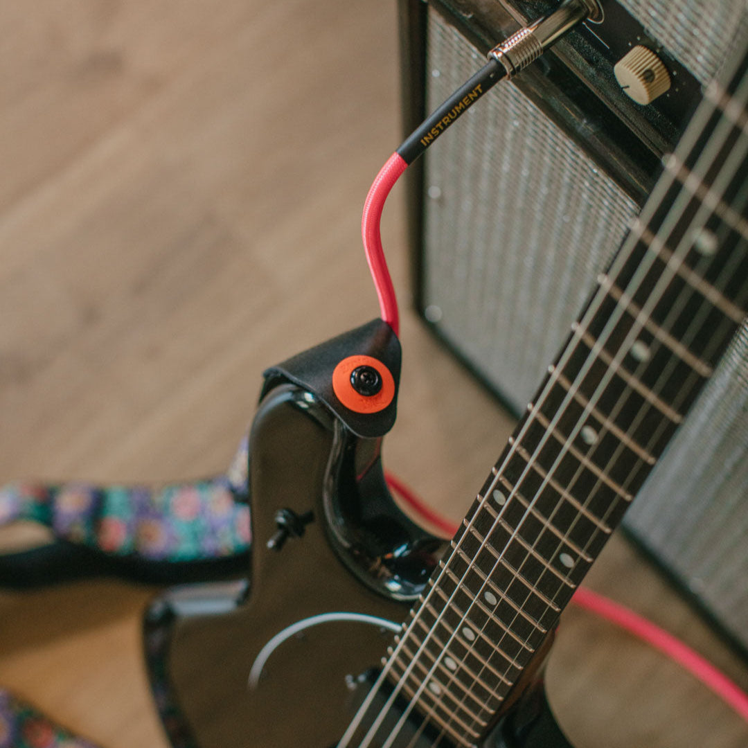 Ernie Ball Strap Fastening Blocks, Red & Black, 4-Pack